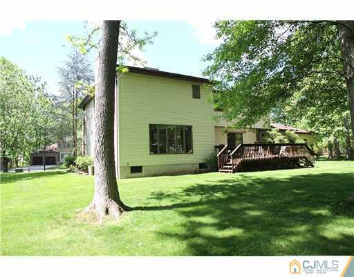 80 Ellmyer Road Edison, NJ 08820 - Photo 23 of 25 a view of a house with backyard and a tree