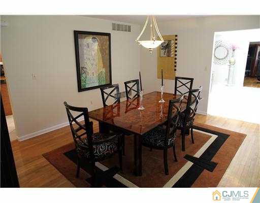 80 Ellmyer Road Edison, NJ 08820 - Photo 5 of 25 a view of a dining room with furniture and wooden floor