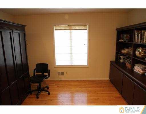 80 Ellmyer Road Edison, NJ 08820 - Photo 9 of 25 a living room with furniture and a window