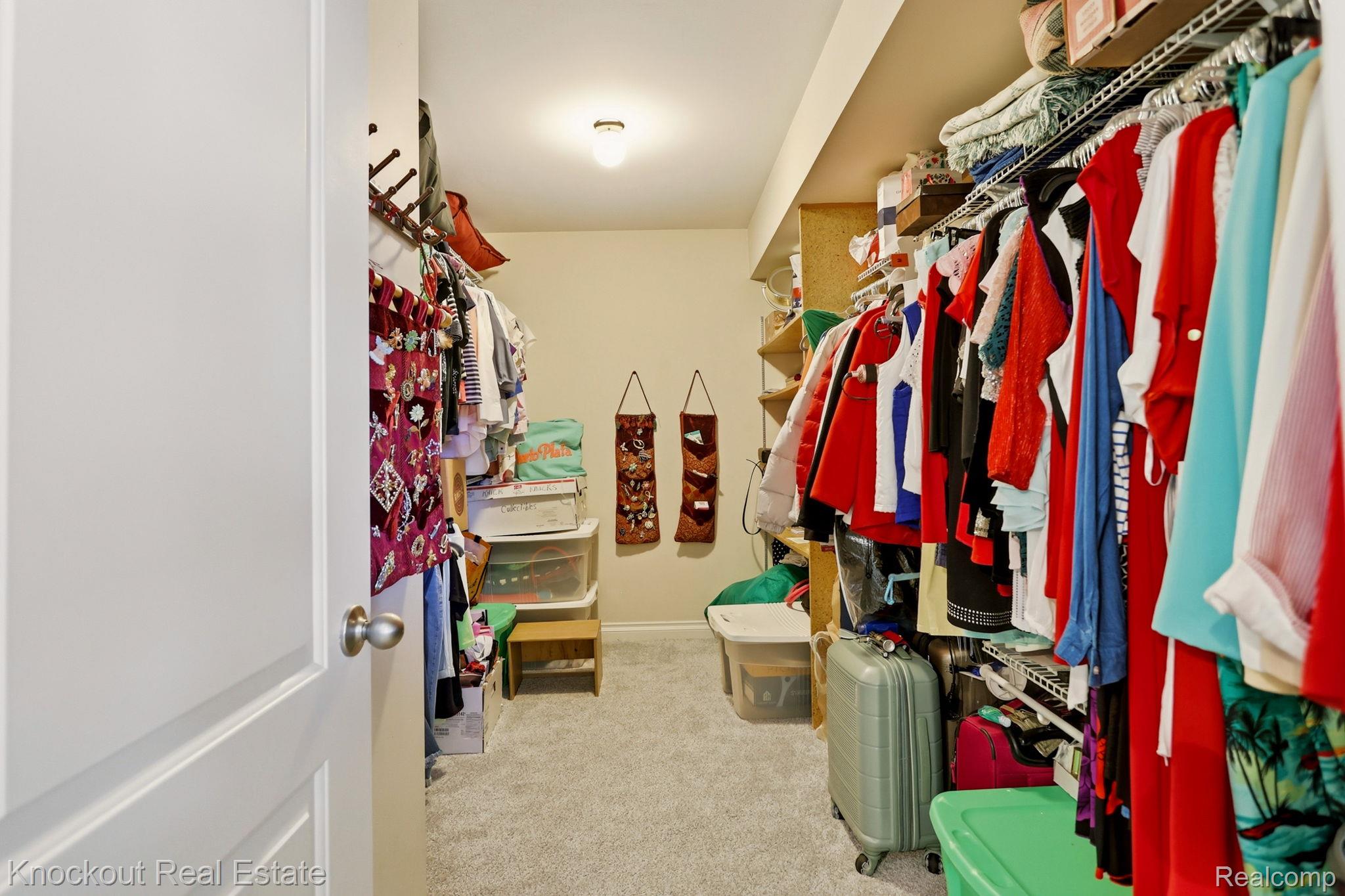 249 Churchgrove Road Frankenmuth, MI 48734 - Photo 26 of 44 Walk-in closet featuring carpet flooring, built-in wire shelving, recessed lighting, and a neutral wall color