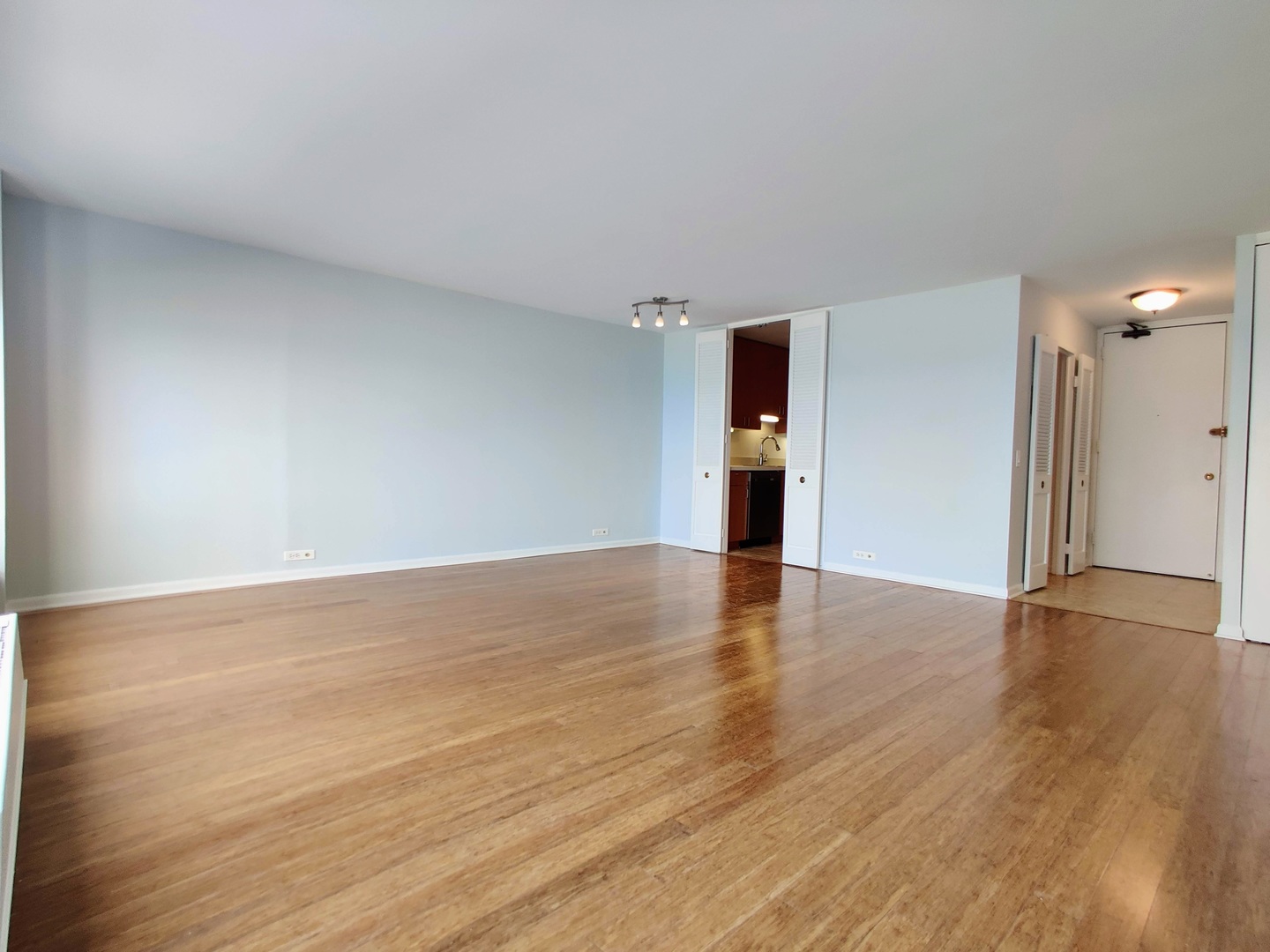 5445 North Sheridan Road, Unit 2504 Chicago, IL 60640 - Photo 16 of 37 a view of empty room with wooden floor
