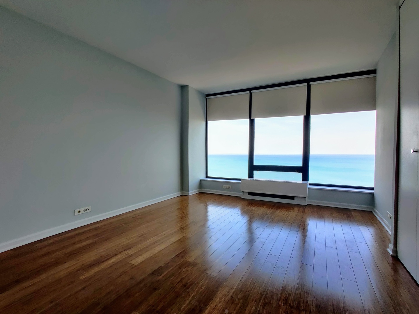 5445 North Sheridan Road, Unit 2504 Chicago, IL 60640 - Photo 20 of 37 a view of a room with wooden floor and window