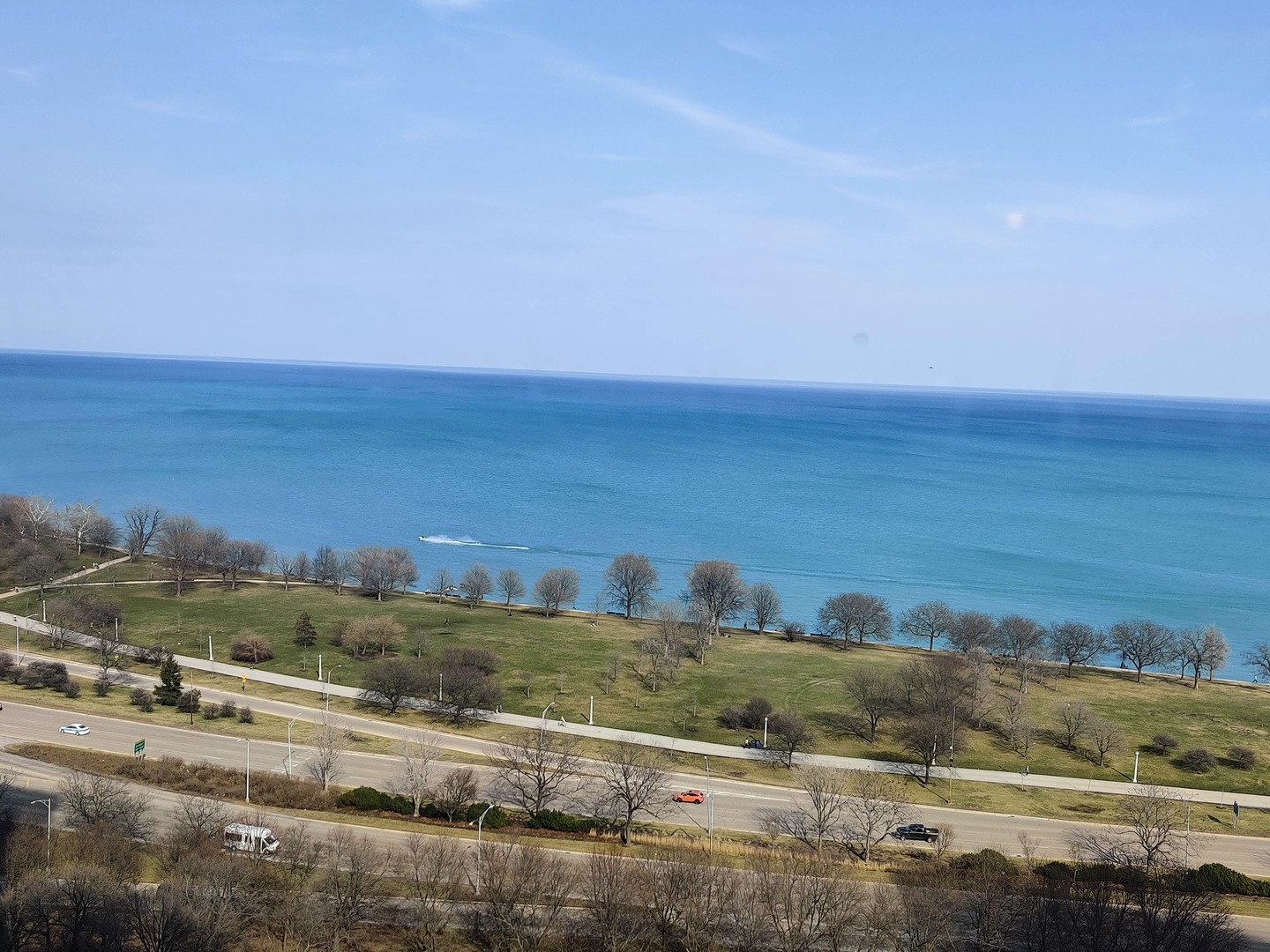 5445 North Sheridan Road, Unit 2504 Chicago, IL 60640 - Photo 3 of 37 a view of an ocean beach and mountain