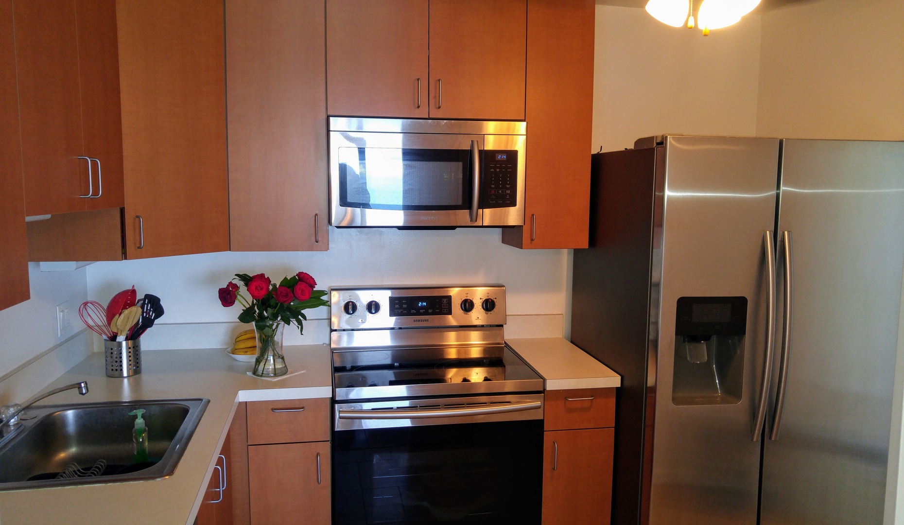 5445 North Sheridan Road, Unit 2504 Chicago, IL 60640 - Photo 8 of 37 a kitchen with a sink and a refrigerator