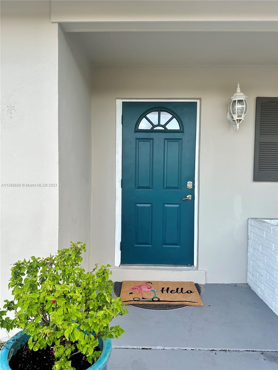 300 E Circle Jupiter, FL 33458 - Photo 1 of 28 a door view with a potted plant