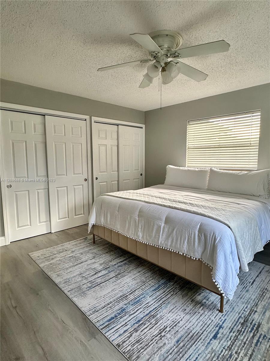 300 E Circle Jupiter, FL 33458 - Photo 26 of 28 a bedroom with a bed and window