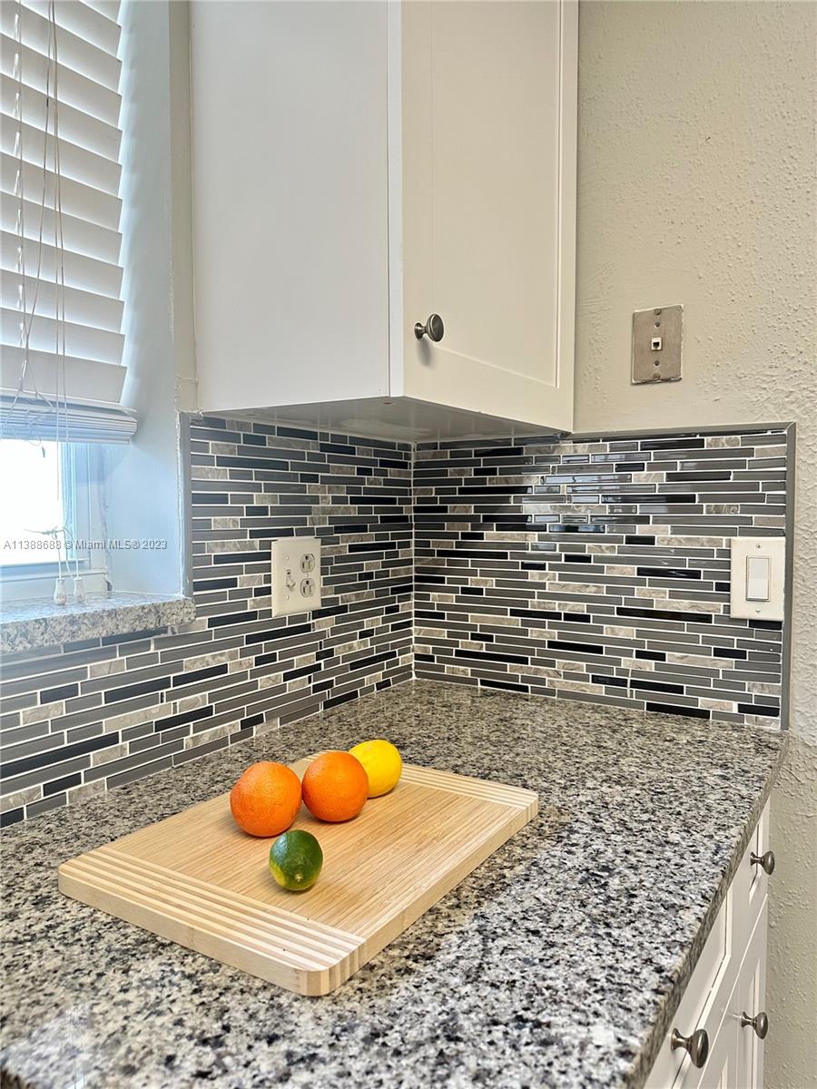 300 E Circle Jupiter, FL 33458 - Photo 5 of 28 a view of a kitchen with sink and wooden floor