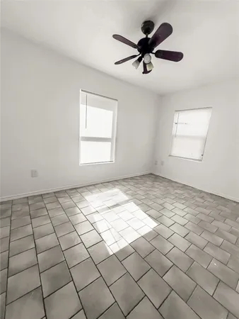 a view of an empty room and window