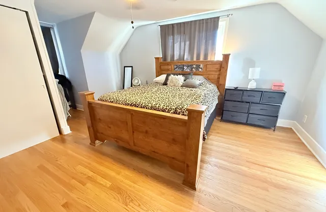 a bed room with a bed and a window