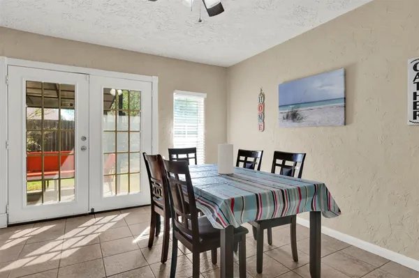 a view of a dining room with furniture and window