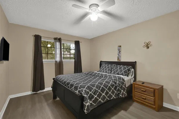 a bedroom with a bed and window