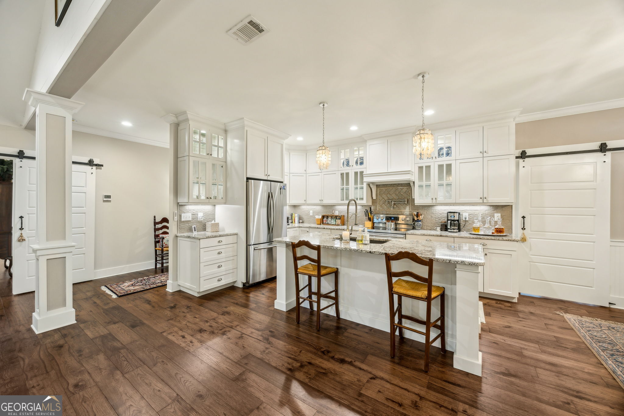 105 Spartina Court St. Marys, GA 31558 - Photo 20 of 95 a kitchen with stainless steel appliances kitchen island granite countertop a refrigerator and a stove top oven