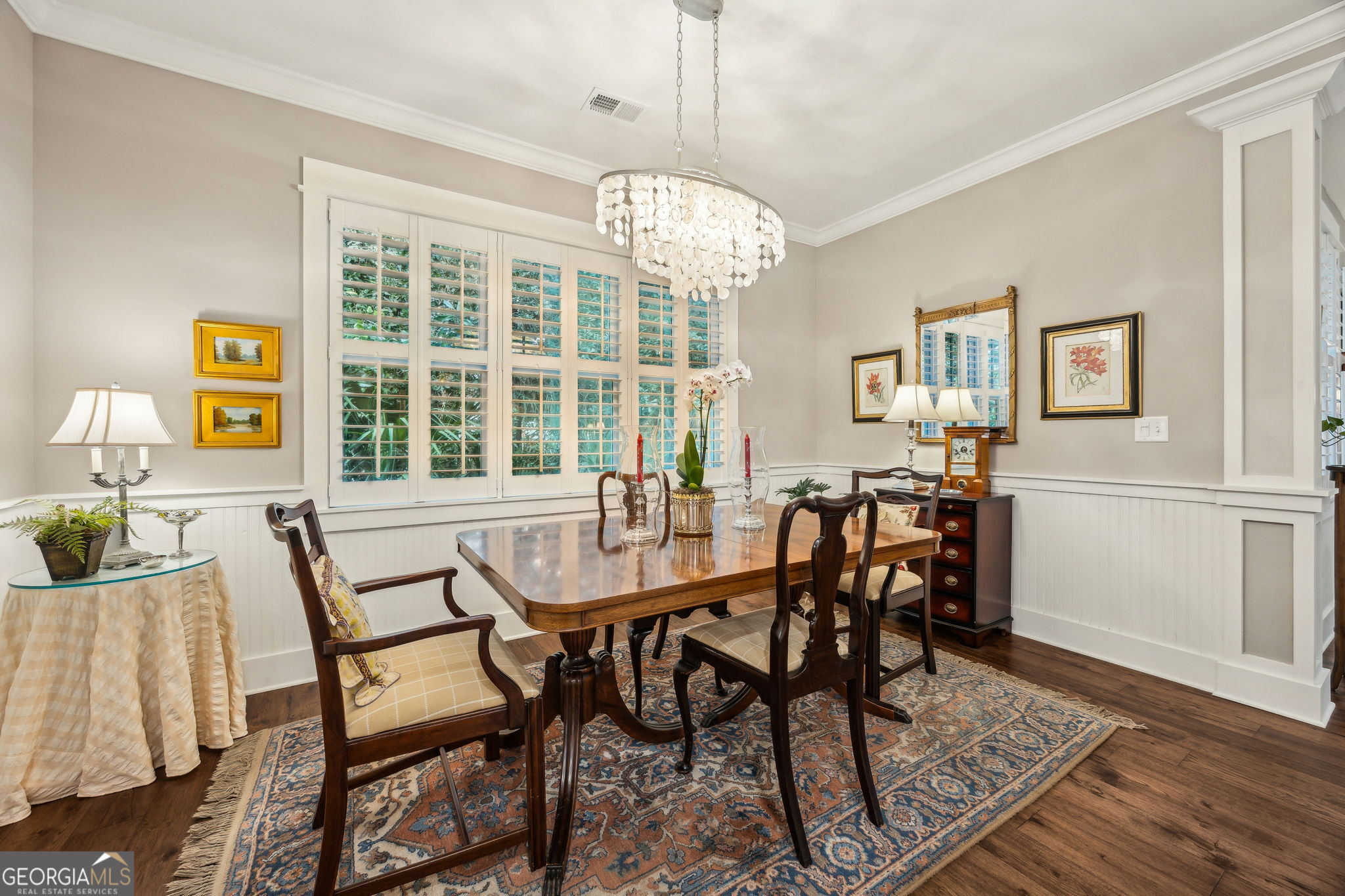 105 Spartina Court St. Marys, GA 31558 - Photo 25 of 95 a view of a dining room with furniture a chandelier and wooden floor
