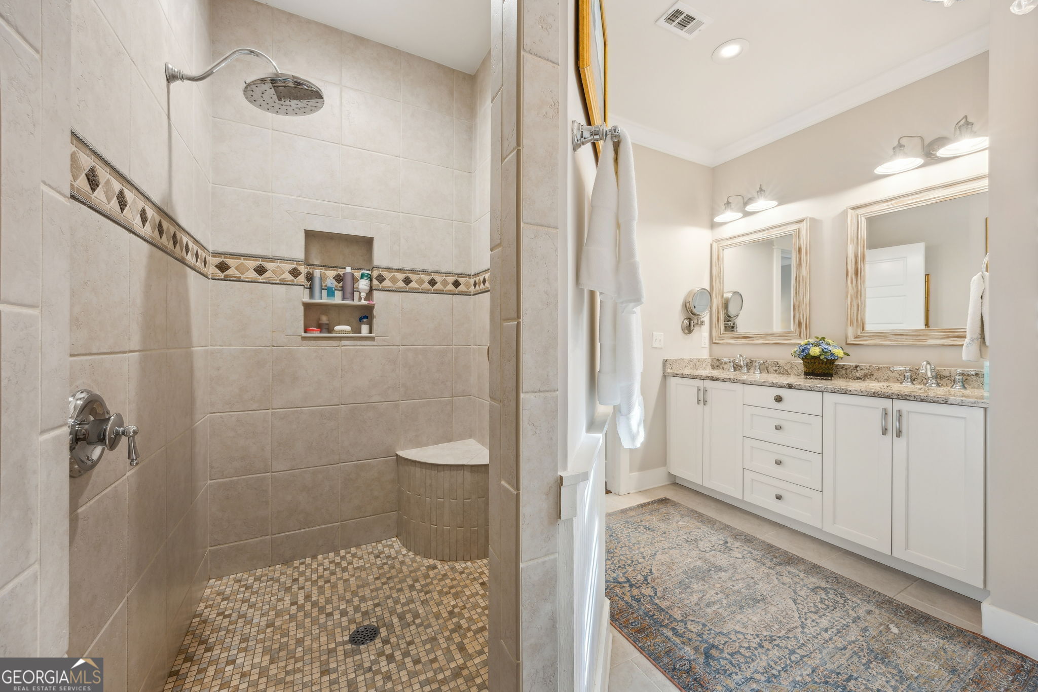 105 Spartina Court St. Marys, GA 31558 - Photo 39 of 95 a spacious bathroom with a shower sink and mirror