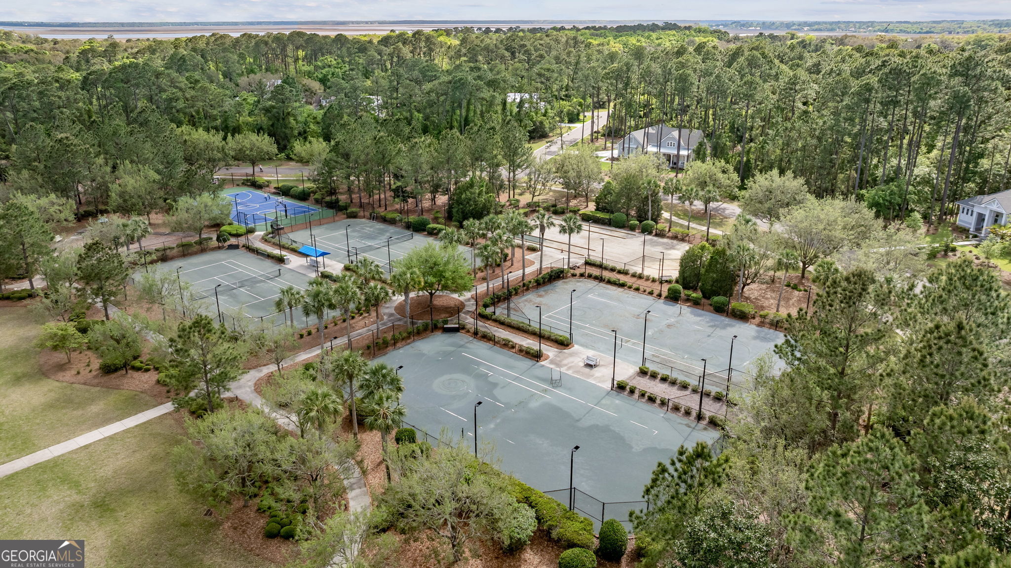 105 Spartina Court St. Marys, GA 31558 - Photo 75 of 95 an aerial view of residential houses with outdoor space and trees