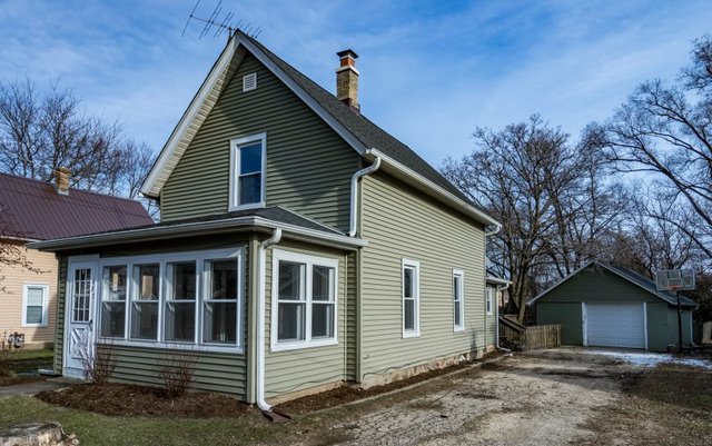 407 Maple Street Marengo, IL 60152 - Photo 2 of 24 a view of a house with a yard