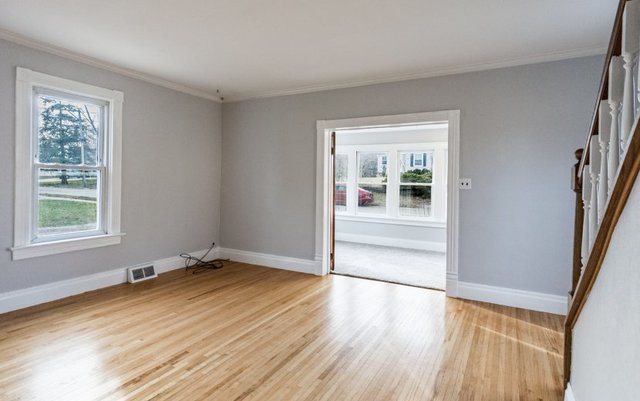 407 Maple Street Marengo, IL 60152 - Photo 11 of 24 a view of an empty room with wooden floor and a window