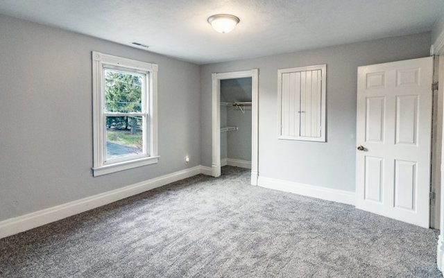 407 Maple Street Marengo, IL 60152 - Photo 20 of 24 an empty room with windows