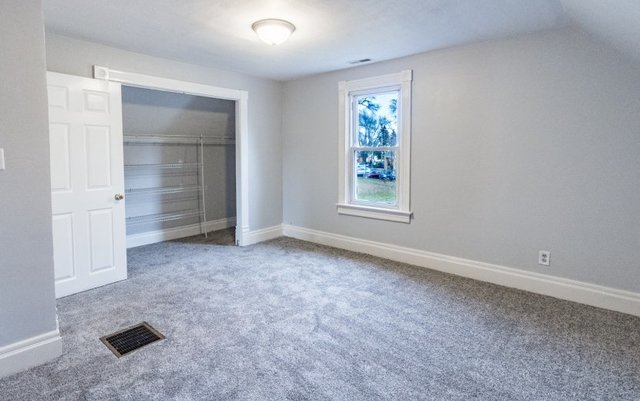 407 Maple Street Marengo, IL 60152 - Photo 21 of 24 an empty room with windows and closet