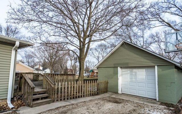 407 Maple Street Marengo, IL 60152 - Photo 22 of 24 a front view of a house with a yard and garage