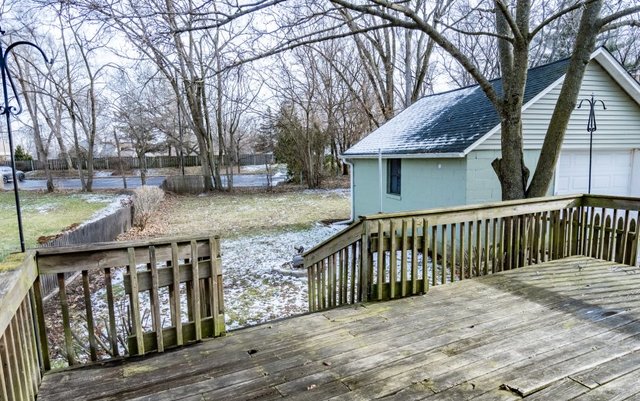407 Maple Street Marengo, IL 60152 - Photo 23 of 24 a view of a wooden fence and trees