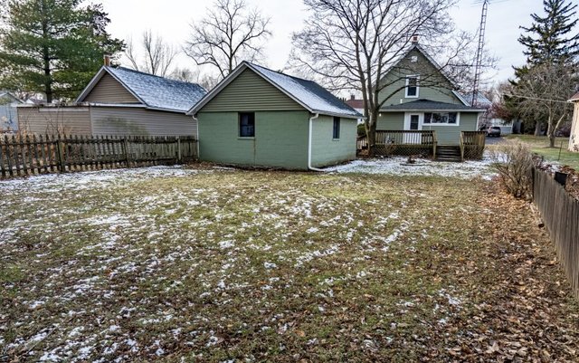 407 Maple Street Marengo, IL 60152 - Photo 24 of 24 a front view of a house with a yard and garage