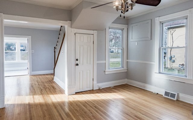 407 Maple Street Marengo, IL 60152 - Photo 10 of 24 wooden floor in an empty room with a window