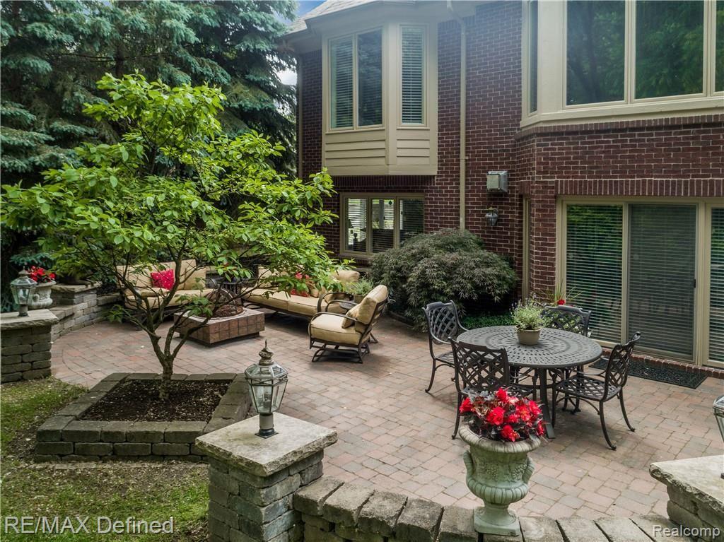 5637 Kirkridge Trail Rochester, MI 48306 - Photo 29 of 36 Gorgeous outdoor living area with the soothing sounds of the waterfall providing background music.