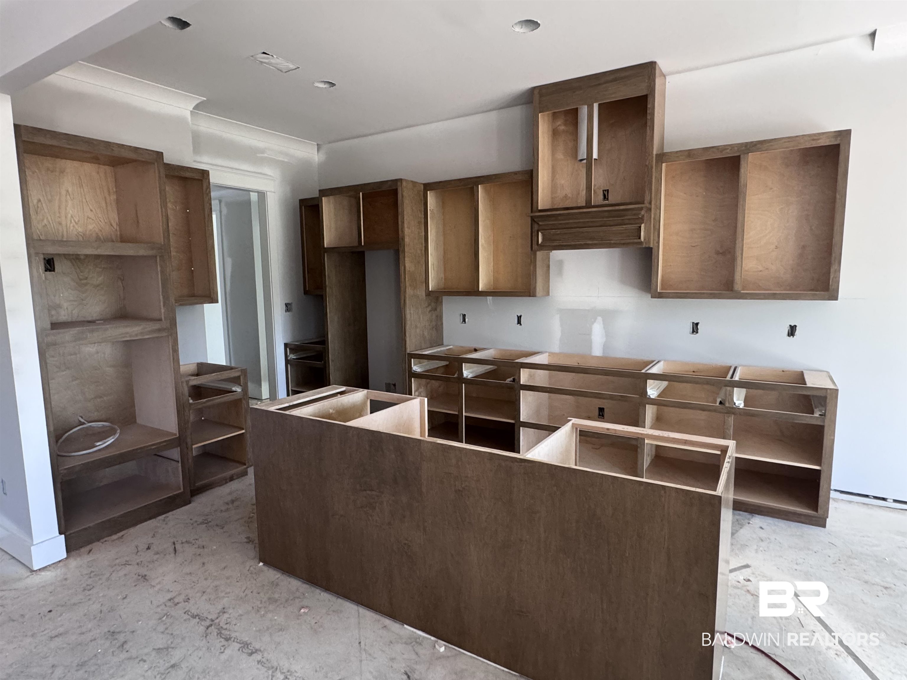27371 Patch Pl Loop Daphne, AL 36526 - Photo 10 of 63 Kitchen with concrete floors, a center island, and white electric cooktop