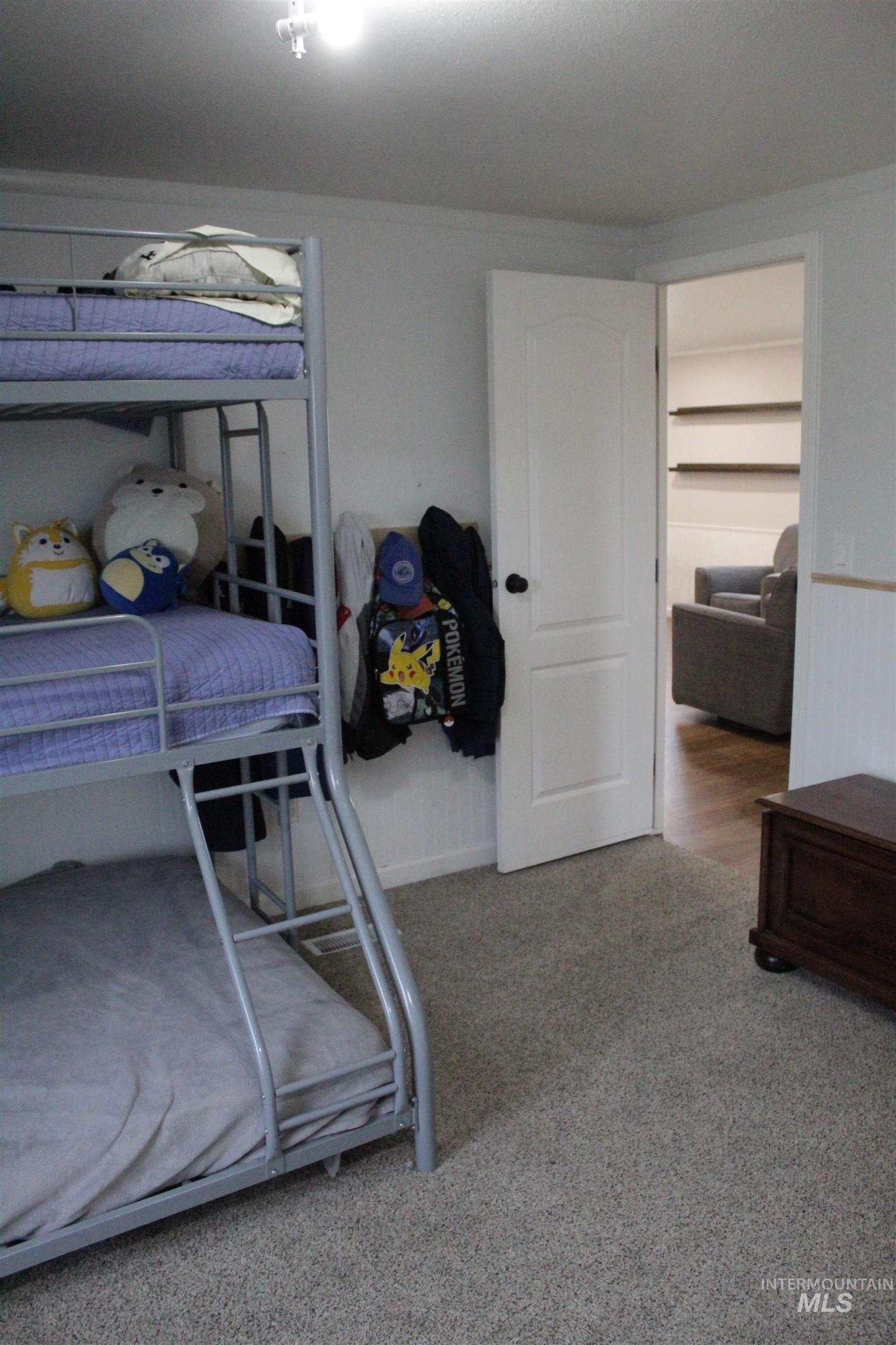 27520 Pearl Road Parma, ID 83660 - Photo 18 of 29 Bedroom featuring light carpet and baseboards