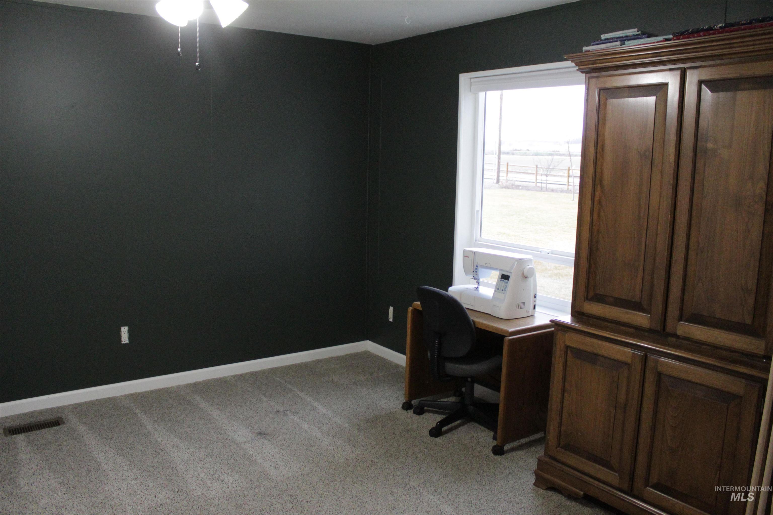27520 Pearl Road Parma, ID 83660 - Photo 7 of 29 Office space featuring light carpet and ceiling fan