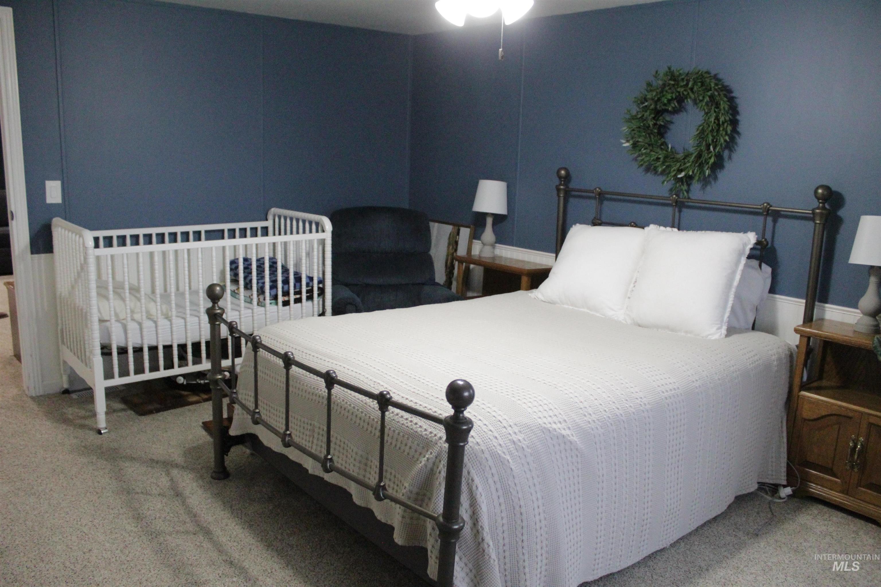 27520 Pearl Road Parma, ID 83660 - Photo 8 of 29 Bedroom featuring light colored carpet and ceiling fan
