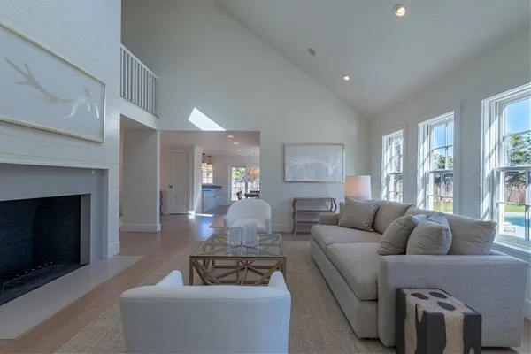 a living room with furniture and a fireplace