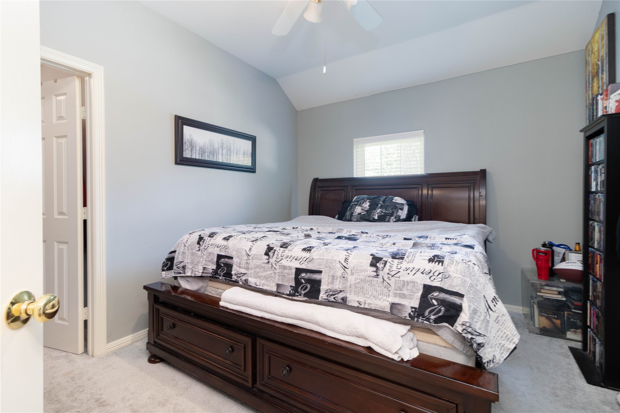 4515 Mulberry Park Lane Houston, TX 77345 - Photo 21 of 32 a bedroom with a bed and a lamp on dresser