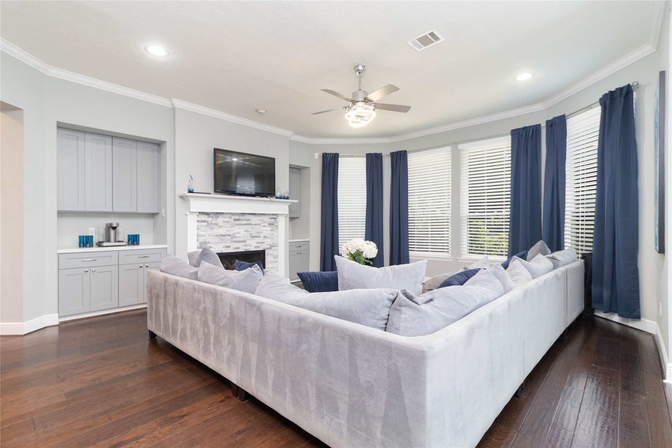 4515 Mulberry Park Lane Houston, TX 77345 - Photo 9 of 32 a living room with furniture fireplace and flat screen tv