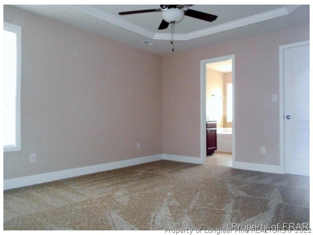 3140 Thrower Road Hope Mills, NC 28348 - Photo 14 of 23 an empty room with ceiling fan and window