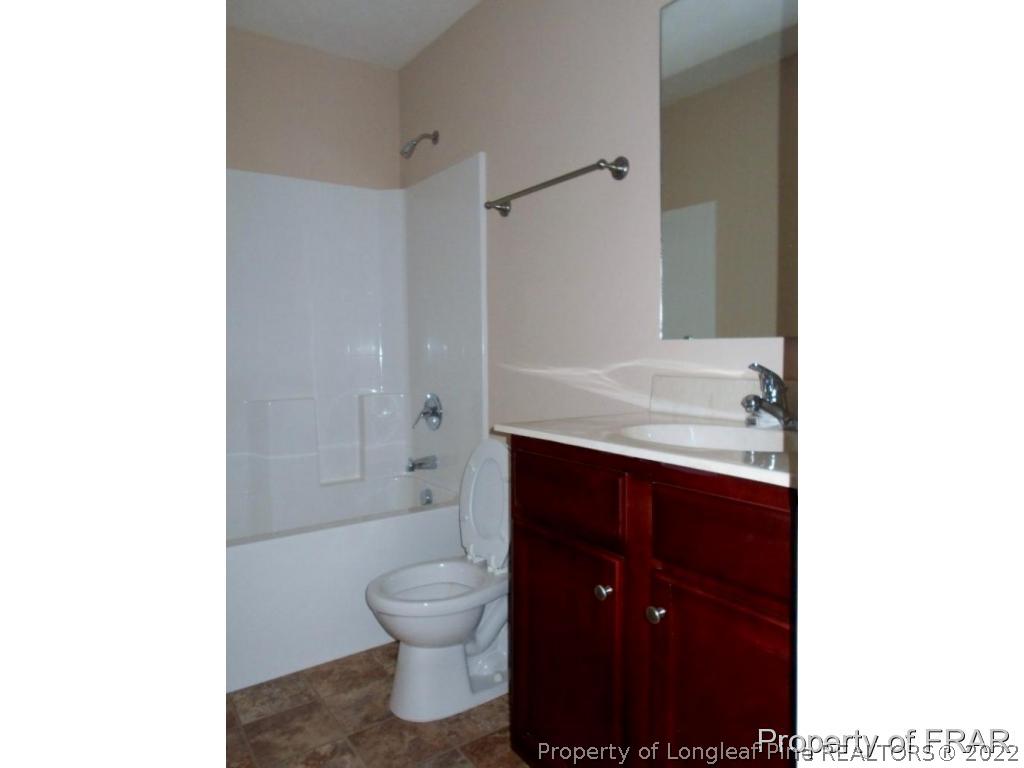 3140 Thrower Road Hope Mills, NC 28348 - Photo 18 of 23 a bathroom with a sink and a toilet