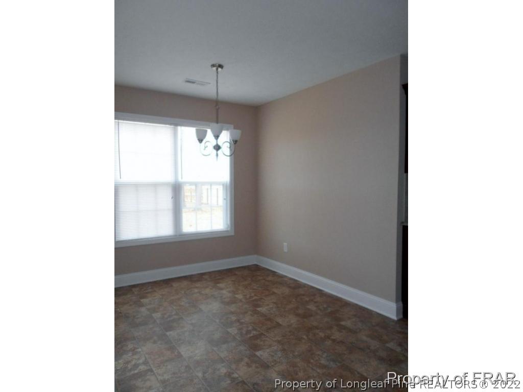 3140 Thrower Road Hope Mills, NC 28348 - Photo 9 of 23 a view of an empty room with a window