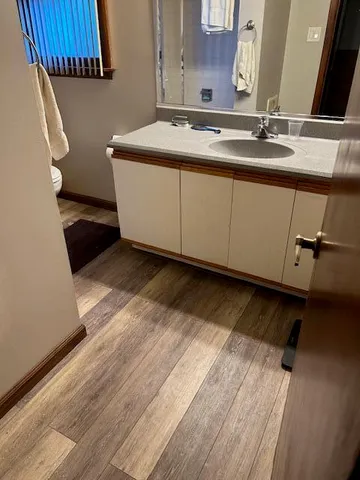 a bathroom with a sink and a mirror