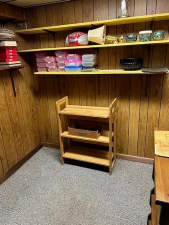 a room with storage and a table