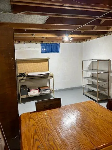 a bedroom with a bed and a view of closet