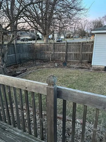 a view of a wooden fence