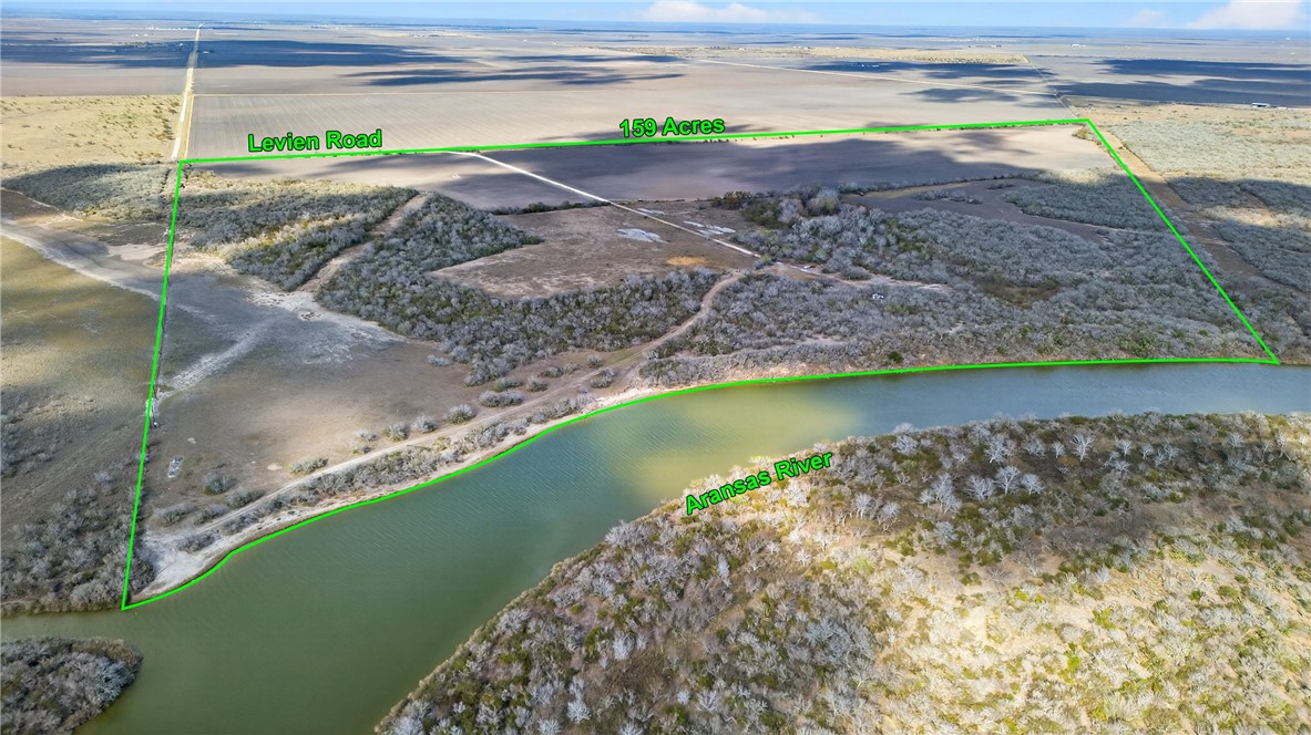 0 Levien Road Woodsboro, TX 78393 - Photo 1 of 35 a view of a lake with a beach