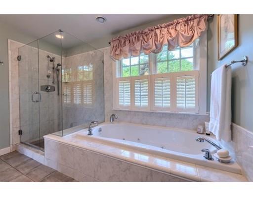 35 Bayberry Hill Road Townsend, MA 01474 - Photo 16 of 38 a bathroom with a tub a sink and a large mirror