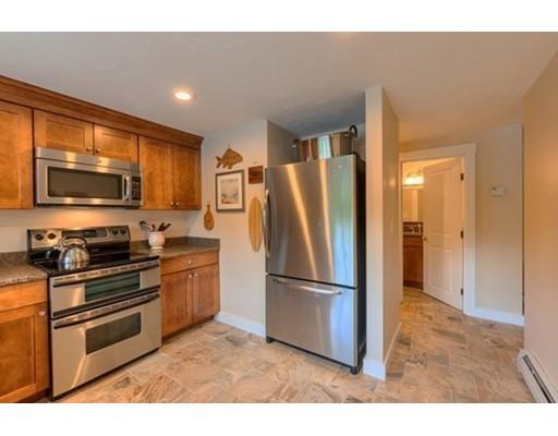 35 Bayberry Hill Road Townsend, MA 01474 - Photo 32 of 38 a kitchen with stainless steel appliances granite countertop a refrigerator stove and microwave