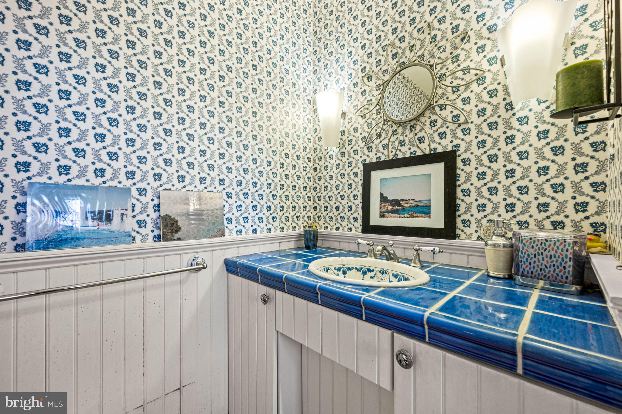601 South Eagle Road Havertown, PA 19083 - Photo 11 of 32 a bathroom with a sink a mirror and shower curtain