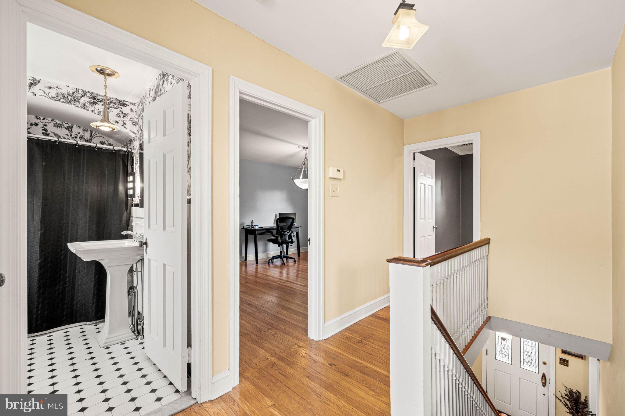 601 South Eagle Road Havertown, PA 19083 - Photo 18 of 37 a view of a hallway with wooden floor and staircase