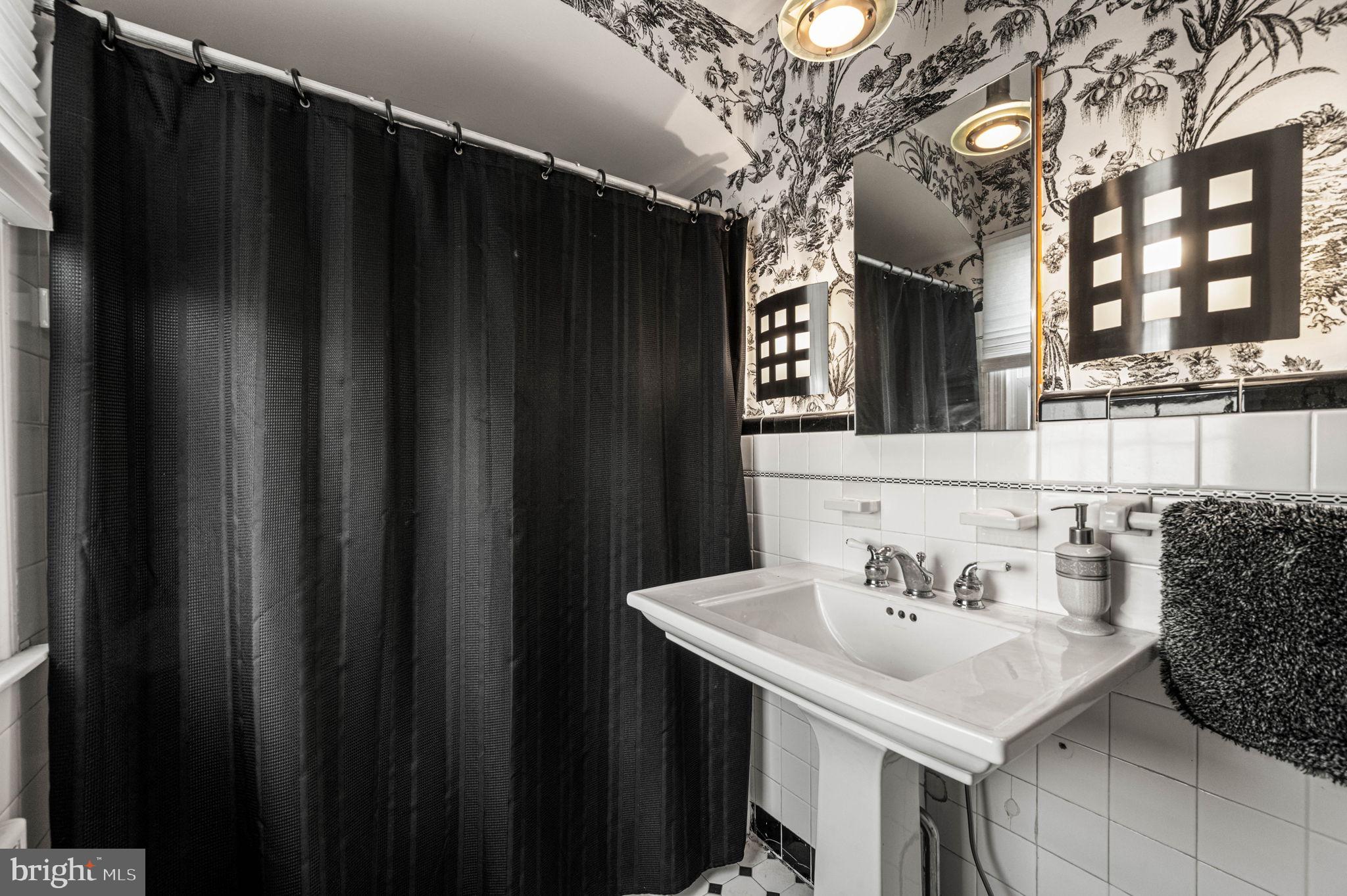 601 South Eagle Road Havertown, PA 19083 - Photo 19 of 37 a bathroom with a sink and a mirror