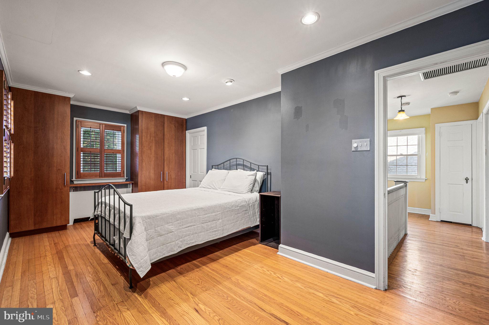 601 South Eagle Road Havertown, PA 19083 - Photo 23 of 37 a room with a bed and wooden floor