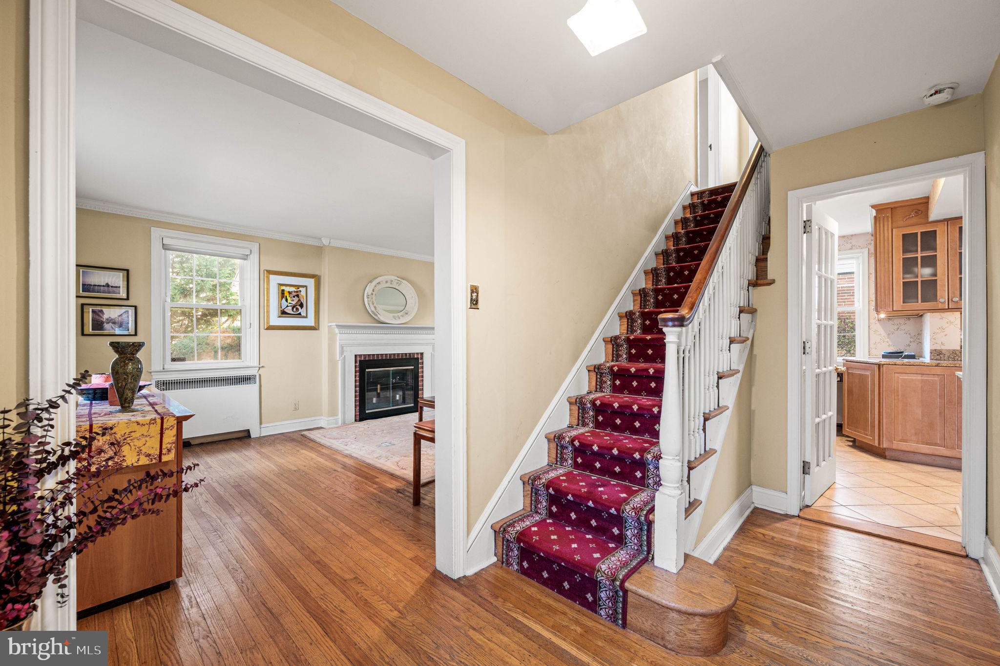 601 South Eagle Road Havertown, PA 19083 - Photo 3 of 37 a view of a livingroom with wooden floor fireplace and staircase
